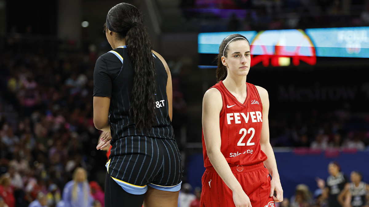 Indiana Fever guard Caitlin Clark (22) walks by Chicago Sky forward Angel Reese (5) during the second half at Wintrust Arena.