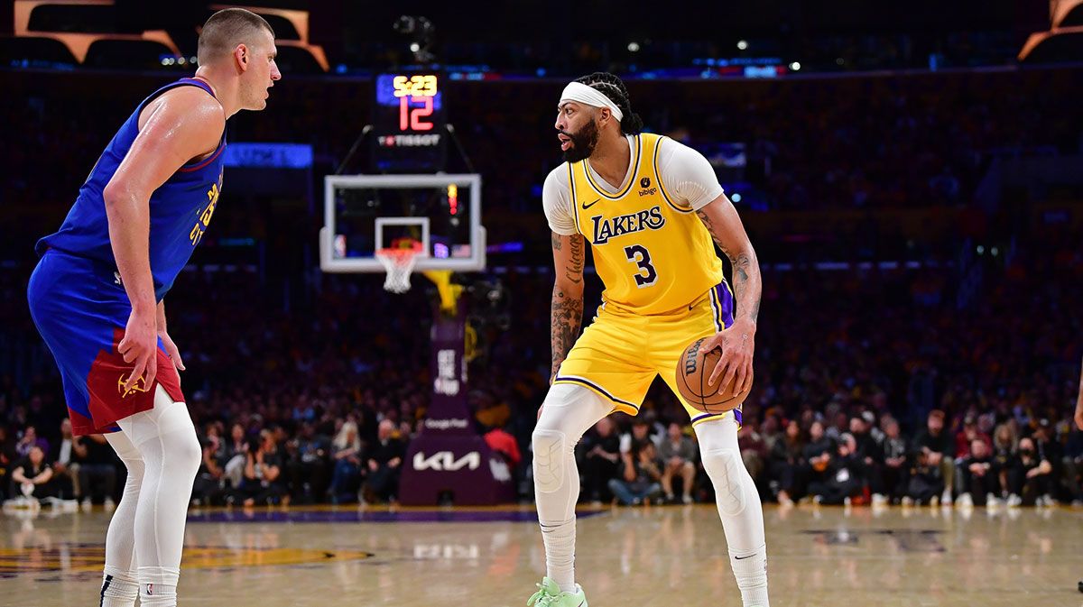 Los Angeles Lakers forward Anthony Davis (3) controls the ball against Denver Nuggets center Nikola Jokic (15) during the second half in game three of the first round for the 2024 NBA playoffs at Crypto.com Arena. 