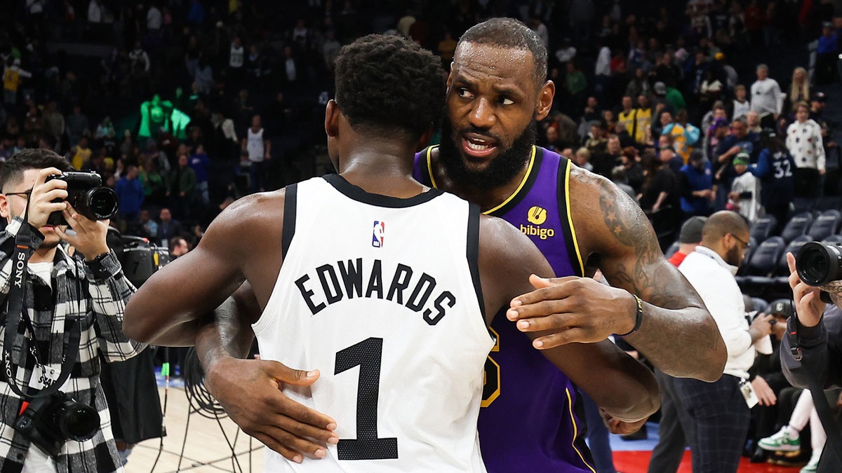 Anthony Edwards (1) and Los Angeles Lakers forward LeBron James (6) hug after the game