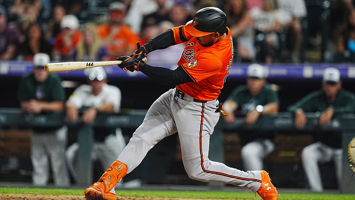 Baltimore Orioles outfielder Anthony Santander (25) hits a double in the eighth inning against the Colorado Rockies at Coors Field.