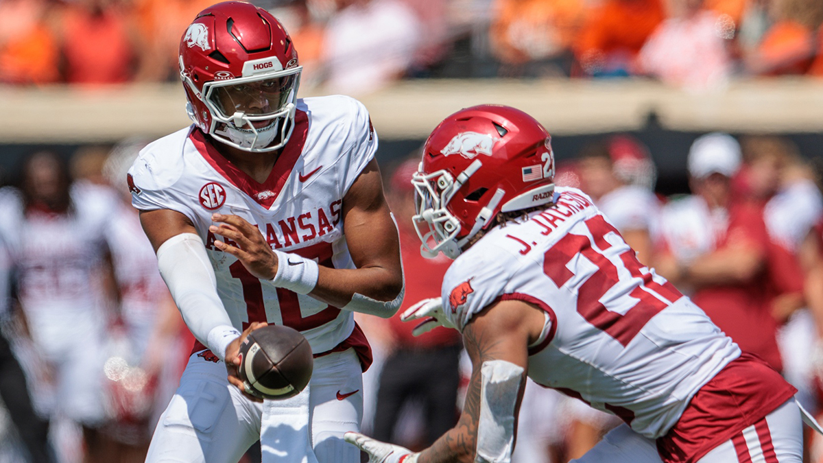 Arkansas Razorbacks quarterback Taylen Green (10) hands off to Arkansas Razorbacks running back Ja'Quinden Jackson (22) during the second quarter against the Oklahoma State Cowboys at Boone Pickens Stadium.