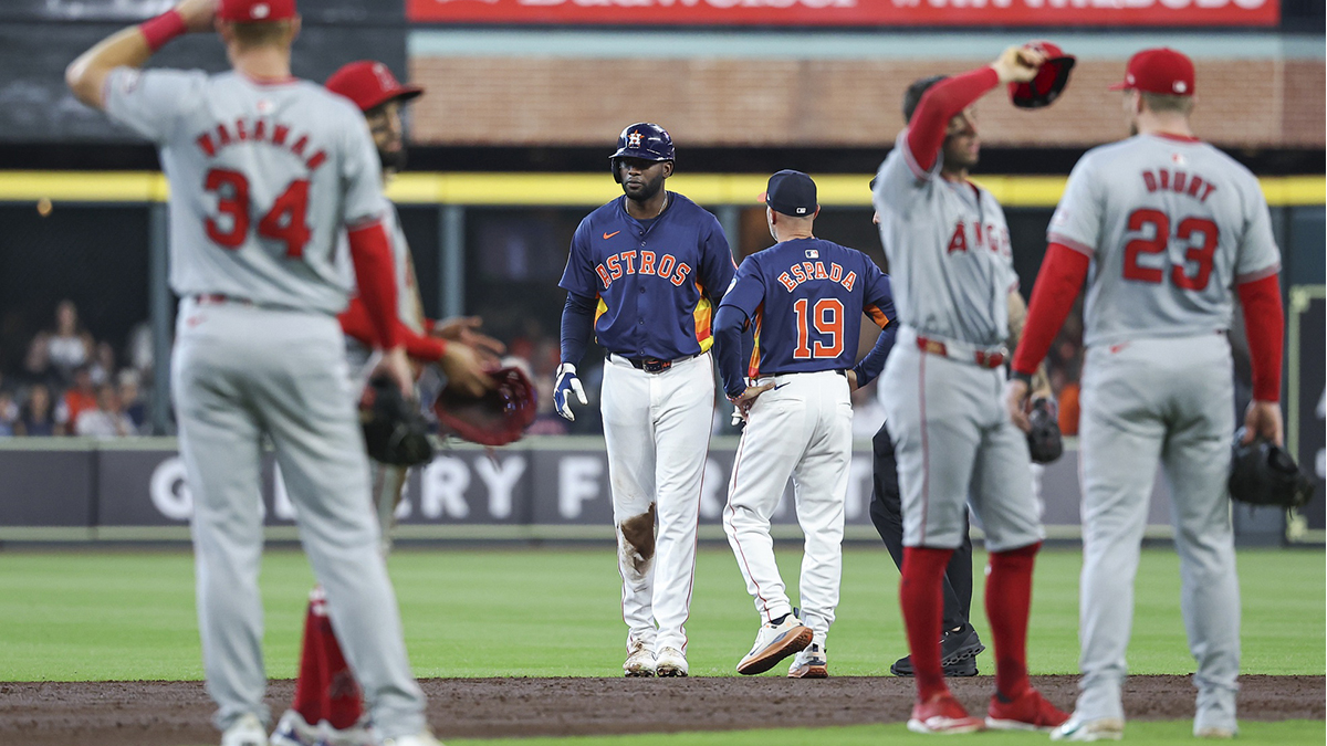 Houston Astros left fielder Yordan Alvarez (44) is evaluated after an apparent injury during the third inning against the Los Angeles Angels at Minute Maid Park.