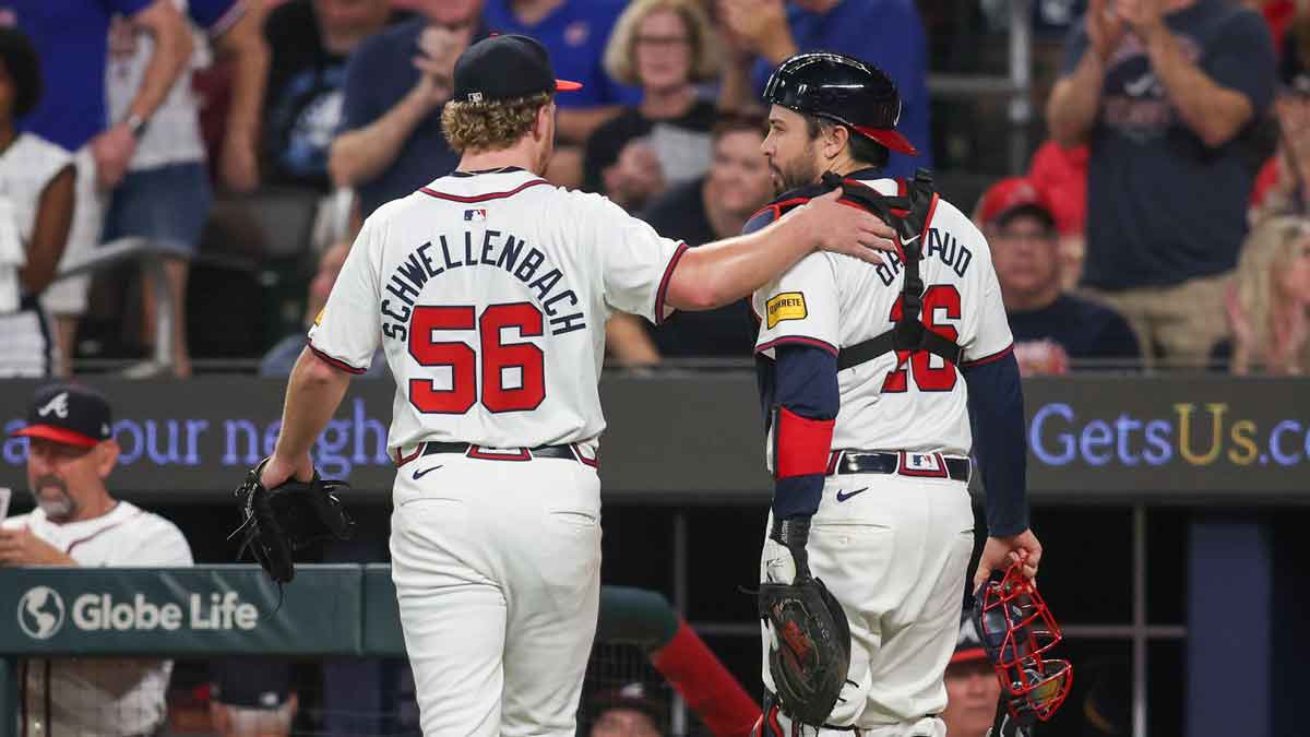 Sep 24, 2024; Atlanta, Georgia, USA; Atlanta Braves starting pitcher Spencer Schwellenbach (56) and catcher Travis d'Arnaud (16) walk off the field against the New York Mets in the seventh inning at Truist Park. Mandatory Credit: Brett Davis-Imagn Images