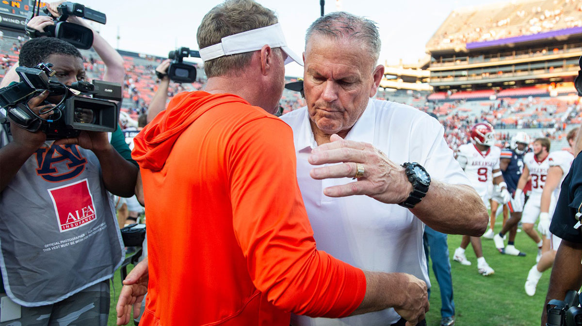 Auburn Tigers head coach Hugh Freeze and Arkansas Razorbacks head coach Sam Pittman hug after the game as Auburn Tigers take on Arkansas Razorbacks at Jordan-Hare Stadium in Auburn, Ala., on Saturday, Sept. 21, 2024. Arkansas Razorbacks defeated Auburn Tigers 24-14.