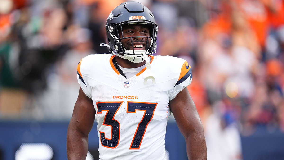Denver Broncos running back Audric Estime (37) celebrates his touchdown in the first quarter against the Arizona Cardinals at Empower Field at Mile High.