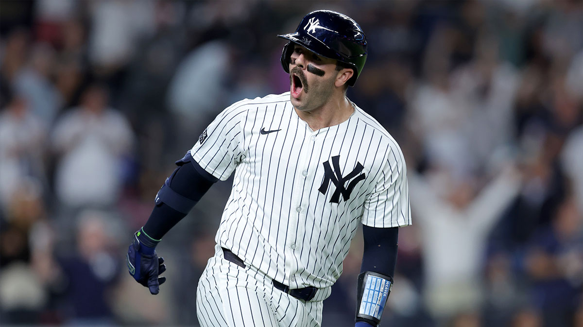 New York Yankees catcher Austin Wells (28) reacts as he rounds the bases after hitting a three run home run against the Kansas City Royals during the seventh inning at Yankee Stadium