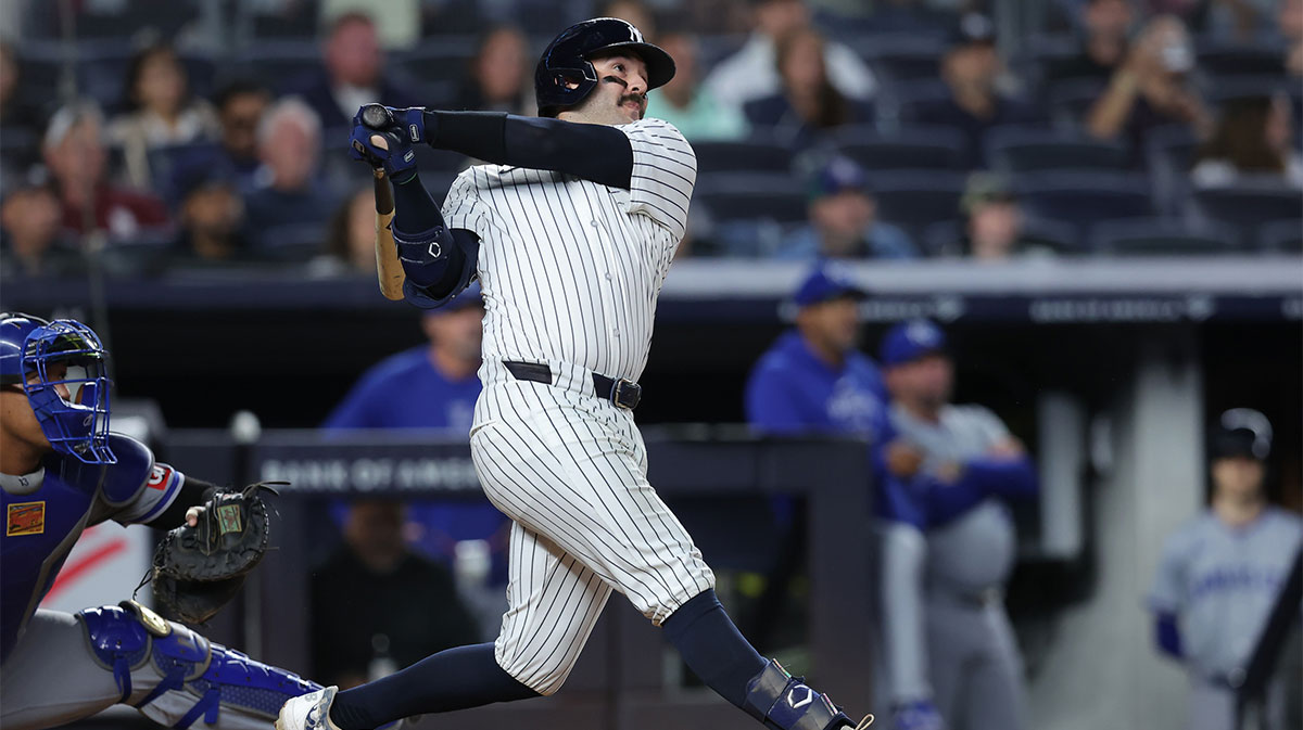 Sep 9, 2024; Bronx, New York, USA; New York Yankees catcher Austin Wells (28) follows through on a three run home run against the Kansas City Royals during the seventh inning at Yankee Stadium.