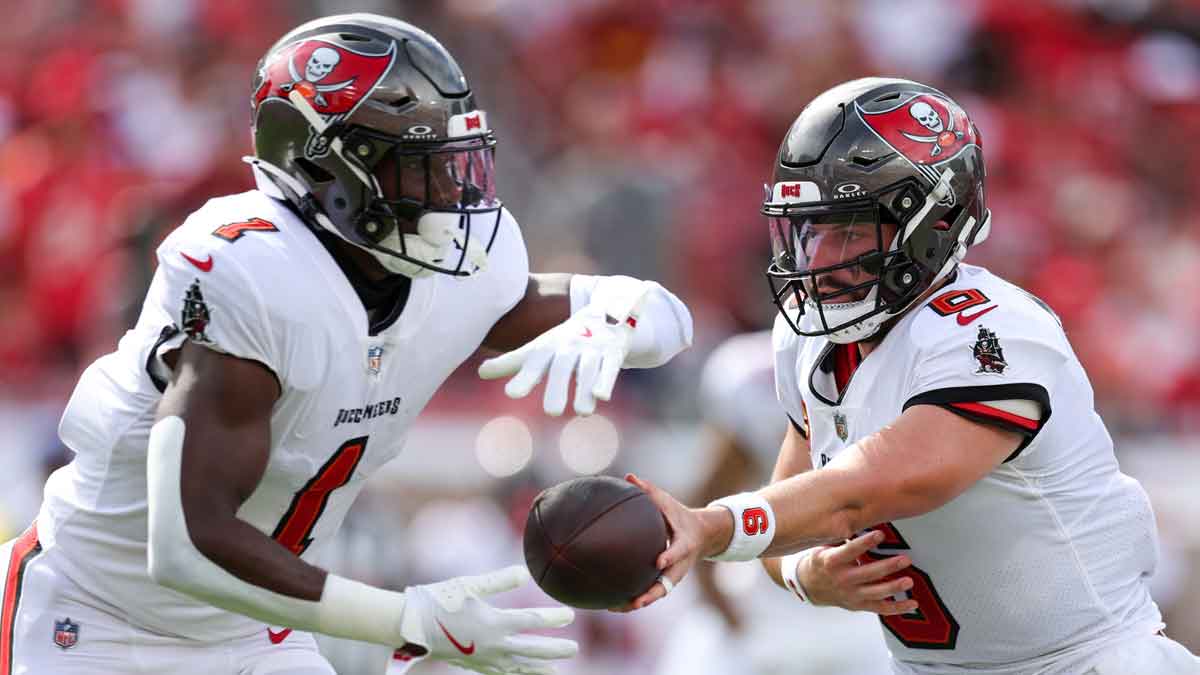 Tampa Bay Buccaneers quarterback Baker Mayfield (6) hands off to running back Rachaad White (1) against the Washington Commanders in the first quarter at Raymond James Stadium. 