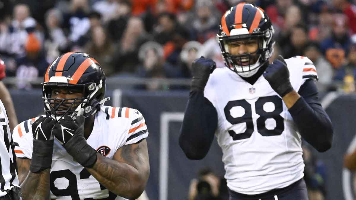 Chicago Bears defensive tackle Justin Jones (93) and Chicago Bears defensive end Montez Sweat (98) signal after Arizona Cardinals quarterback Kyler Murray (1) was sacked by Jones during the first half at Soldier Field.