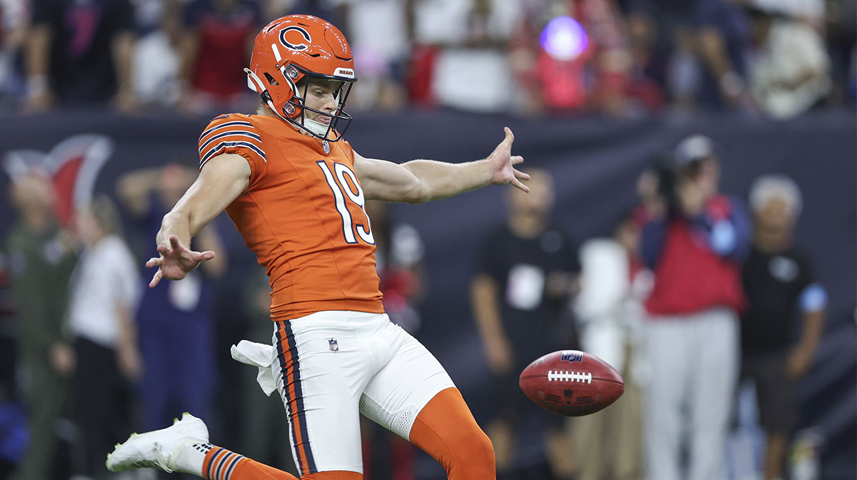 Chicago Bears punter Tory Taylor (19) punts the ball during the game against the Houston Texans at NRG Stadium.