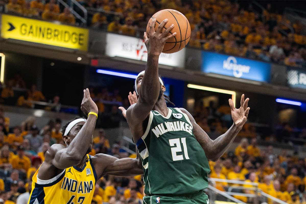 Milwaukee Bucks guard Patrick Beverley (21) shoots the ball while Indiana Pacers forward Pascal Siakam (43) defends during game six of the first round for the 2024 NBA playoffs at Gainbridge Fieldhouse.