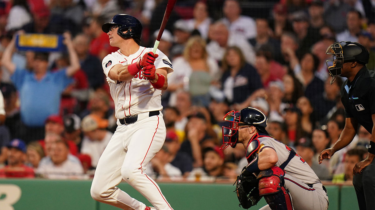 Boston Red Sox right fielder Bobby Dalbec (29) gets a base hit to drive in two runs against the Atlanta Braves in the fourth inning at Fenway Park.
