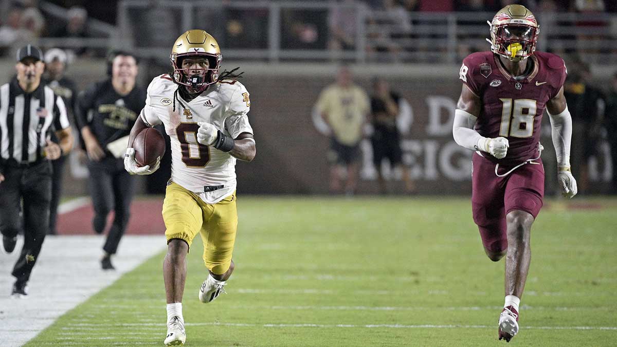 Boston College Eagles running back Treshaun Ward (0) runs the ball down the field past Florida State Seminoles linebacker Cam Riley (18) during the game at Doak S. Campbell Stadium.