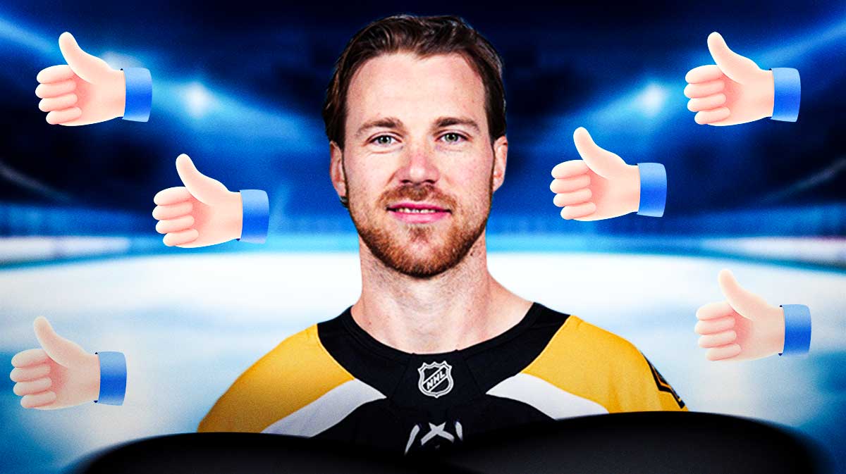 Elias Lindholm in Bruins uniform surrounded by thumbs up emojis