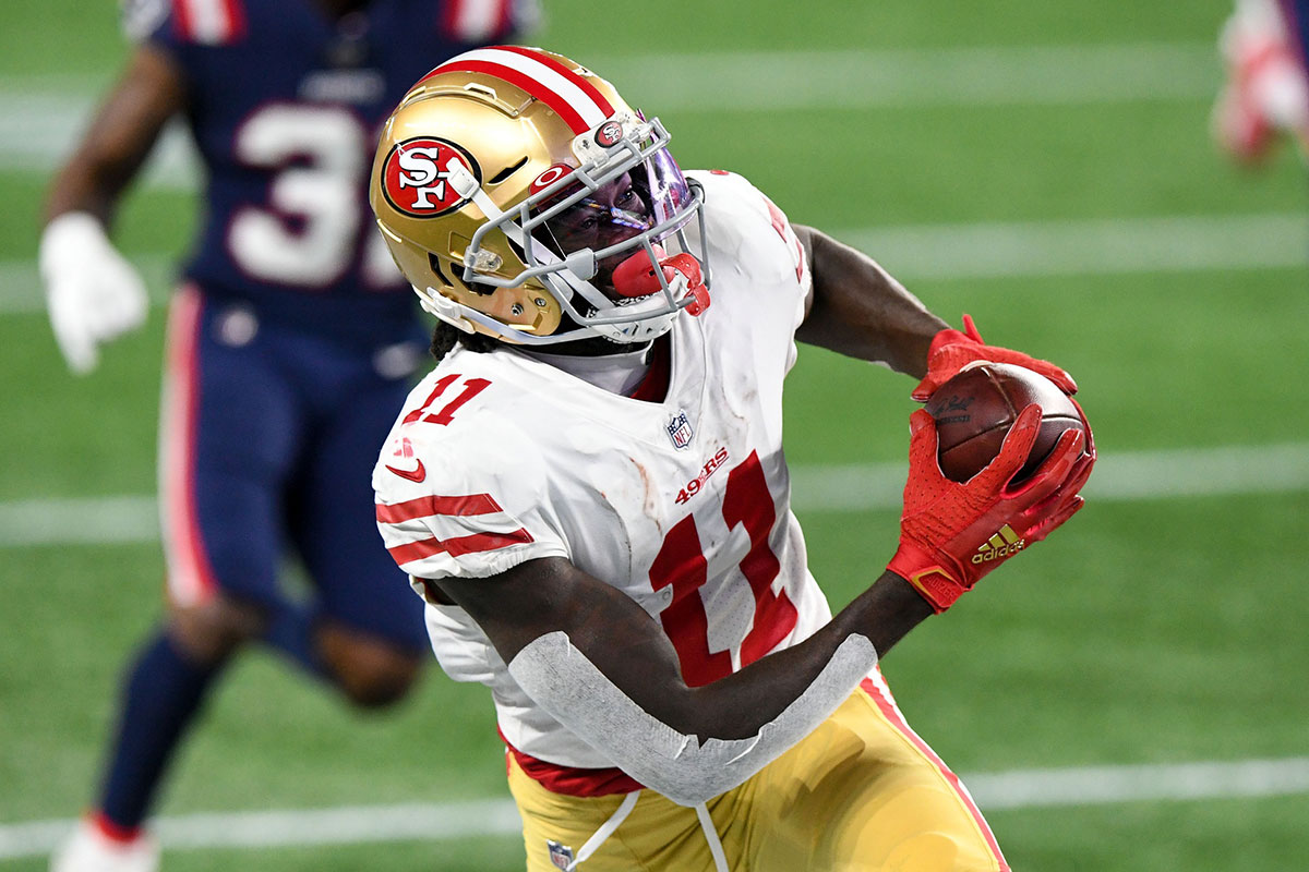 San Francisco 49ers wide receiver Brandon Aiyuk (11) makes a catch on a pass from quarterback Jimmy Garoppolo (not seen) during the second half against the New England Patriots at Gillette Stadium.