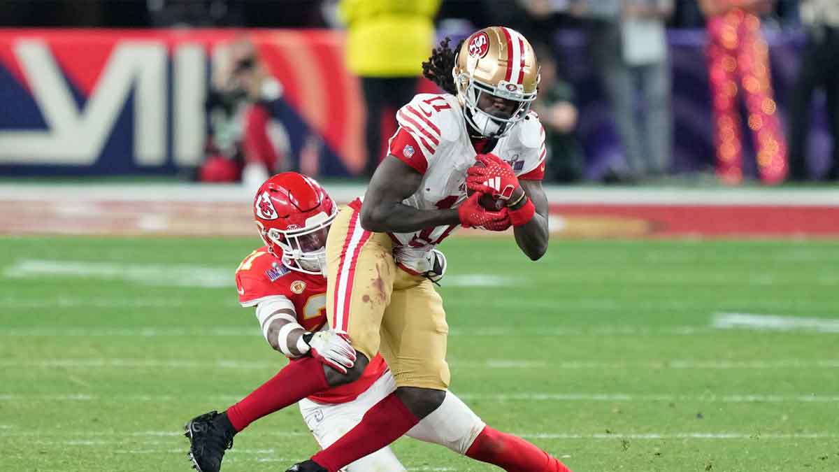 Kansas City Chiefs safety Mike Edwards (21) tackles San Francisco 49ers wide receiver Brandon Aiyuk (11) during overtime of Super Bowl LVIII at Allegiant Stadium.