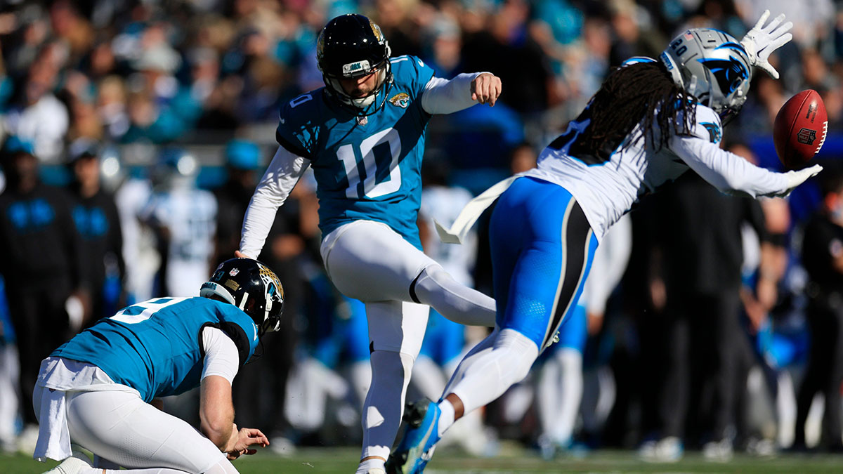 Jacksonville Jaguars place kicker Brandon McManus (10) kicks a field goal as Carolina Panthers cornerback Shaquill Griffin (20) can t make the block and Jaguars punter Logan Cooke (9) holds during the second quarter of a regular season NFL football matchup Sunday, Dec. 31, 2023 at EverBank Stadium in Jacksonville, Fla. The Jacksonville Jaguars blanked the Carolina Panthers 26-0.