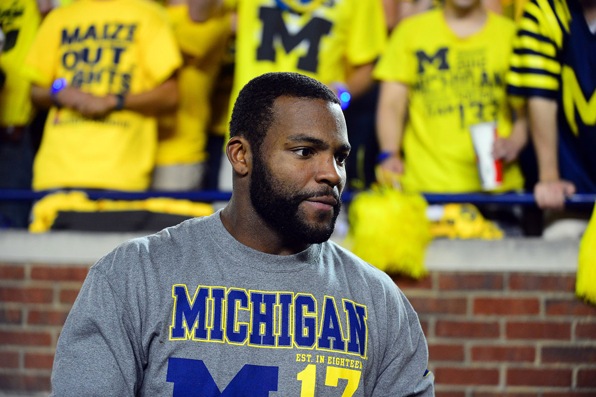 Michigan Wolverines former player Braylon Edwards on the sidelines during the third quarter against the Notre Dame Fighting Irish at Michigan Stadium.