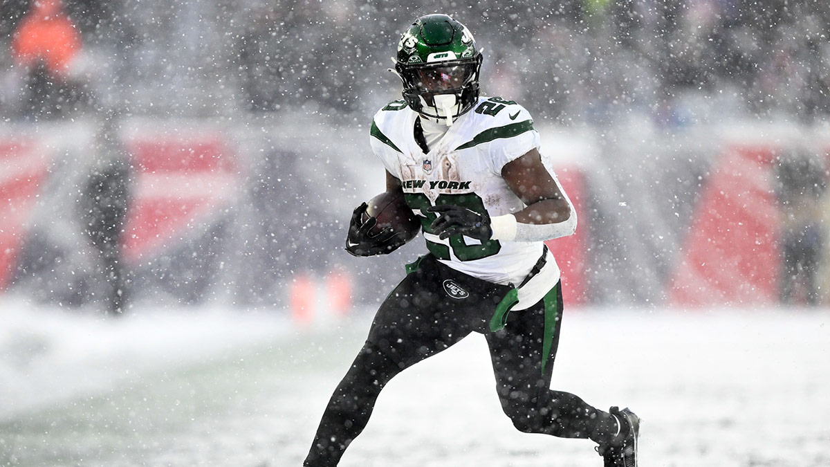 New York Jets running back Breece Hall (20) runs against the New England Patriots during the second half at Gillette Stadium.