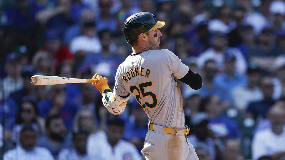 Oakland Athletics outfielder Brent Rooker (25) hits an RBI-single against the Chicago Cubs during the seventh inning at Wrigley Field.