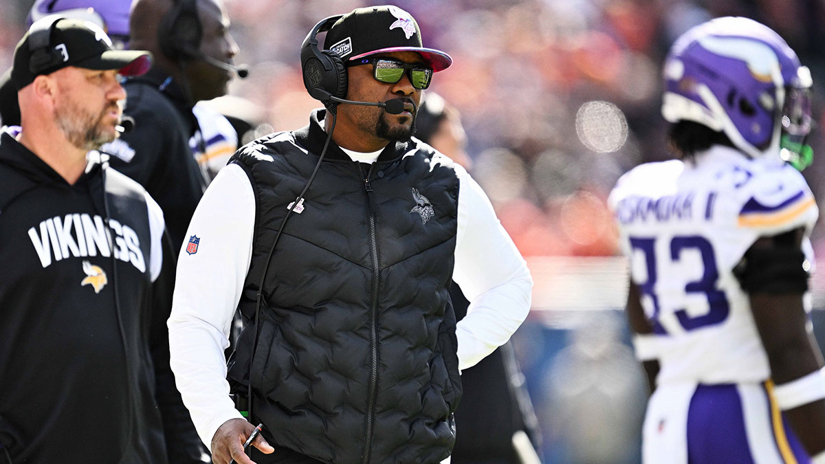 Minnesota Vikings defensive coordinator Brian Flores watches his team play against the Chicago Bears at Soldier Field. 