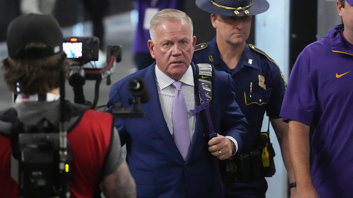 LSU Tigers coach Brian Kelly arrives before the game against the Southern California Trojans at Allegiant Stadium.