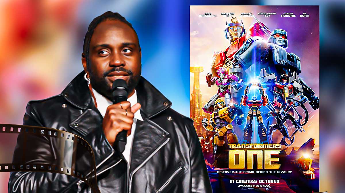 Brian Tyree Henry, who voices Megatron, with Transformers One poster.