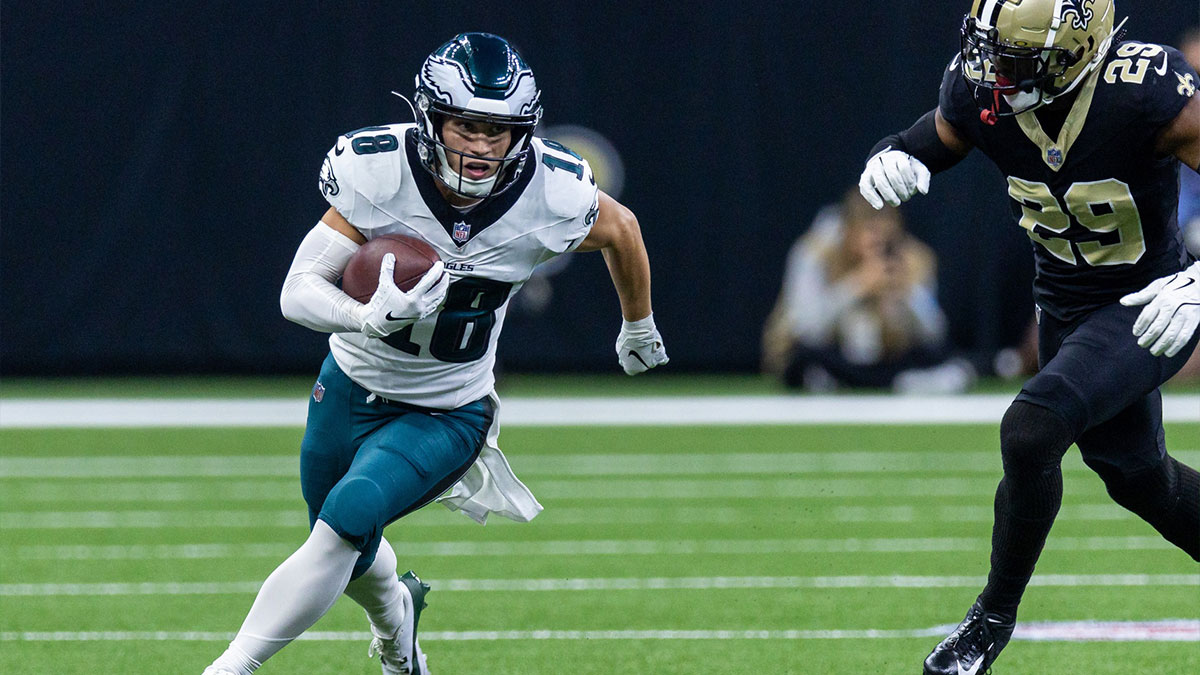 Philadelphia Eagles wide receiver Britain Covey (18) runs a pass back against New Orleans Saints cornerback Paulson Adebo (29) during the first half at Caesars Superdome.
