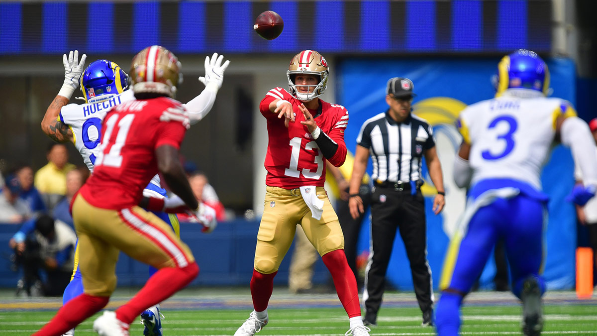 San Francisco 49ers quarterback Brock Purdy (13) throws a pass to wide receiver Brandon Aiyuk (11) against the Los Angeles Rams during the first half at SoFi Stadium.