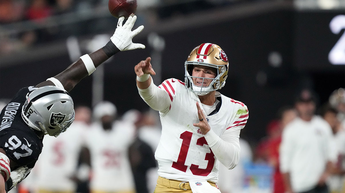 San Francisco 49ers quarterback Brock Purdy (13) throws the ball against Las Vegas Raiders defensive end Janarius Robinson (97) in the first half at Allegiant Stadium. 