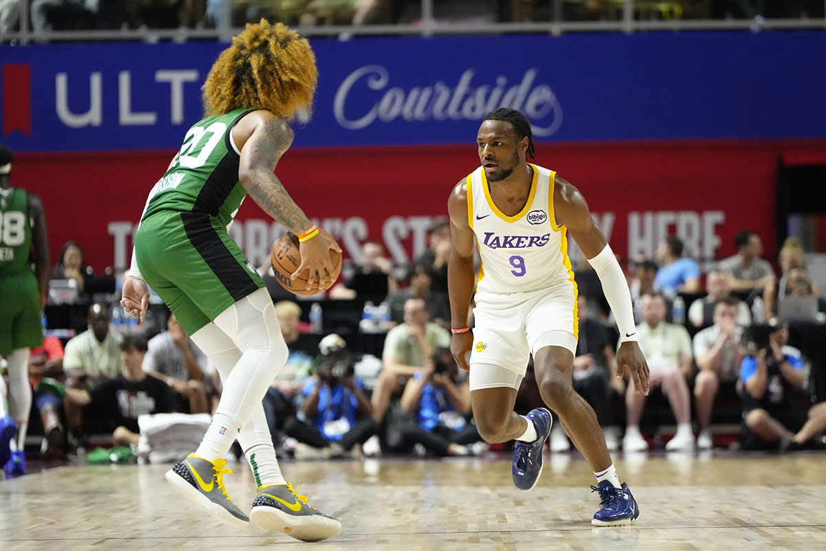 Los Angeles Lakers guard Bronny James (9) defends against Boston Celtics guard JD Davison (20) during the first half at Thomas & Mack Center.