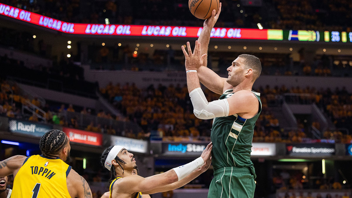 Milwaukee Bucks center Brook Lopez (11) shoots the ball while Indiana Pacers guard Andrew Nembhard (2) defends during game six of the first round for the 2024 NBA playoffs at Gainbridge Fieldhouse.