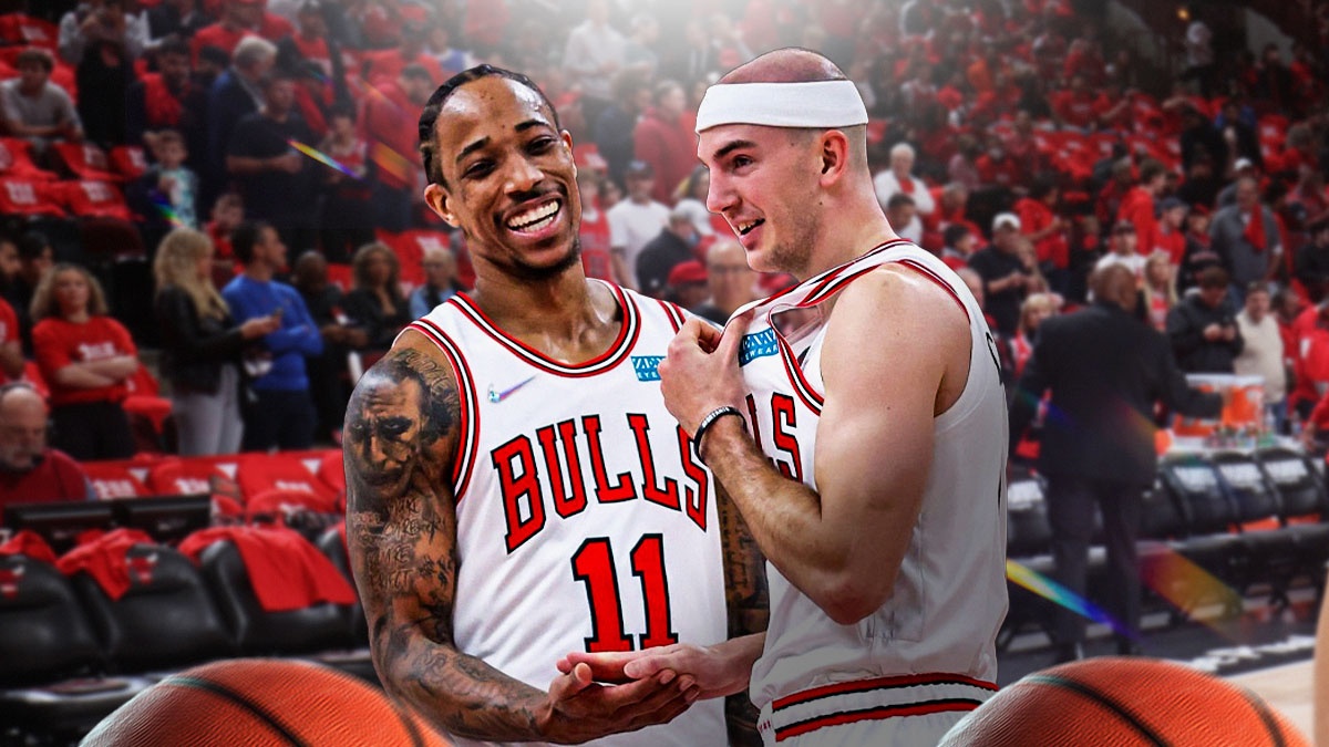 DeMar DeRozan and Alex Caruso wearing Bulls uniform smiling at each other
