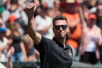 Former San Francisco Giants player Buster Posey acknowledges the crowd during a ceremony celebrating the Giants' 2014 World Series championship team before the game against the Detroit Tigers at Oracle Park.