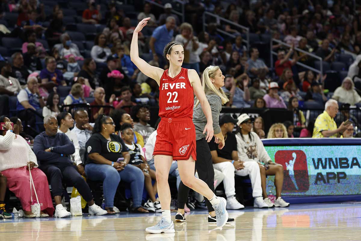 Indiana Fever guard Caitlin Clark (22) reacts as she walks off the floor during the second half of a basketball game against the Chicago Sky at Wintrust Arena. 