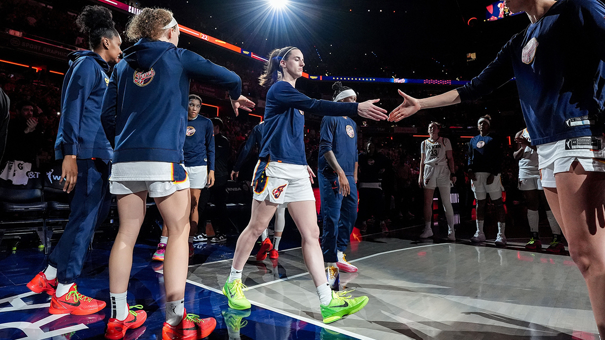 Indiana Fever guard Caitlin Clark (22) shakes hands with Indiana Fever guard Lexie Hull (10) during team introductions on Friday, July 12, 2024, during the game at Gainbridge Fieldhouse in Indianapolis. The Indiana Fever defeated the Phoenix Mercury, 95-86.