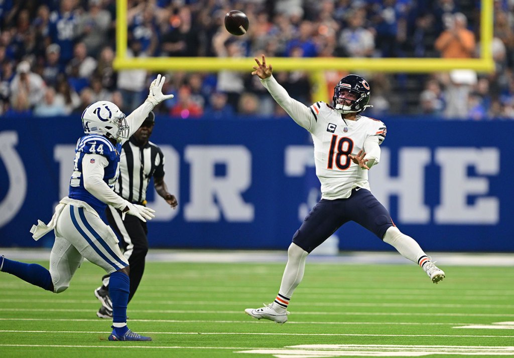 Chicago Bears quarterback Caleb Williams (18) throws the ball over Indianapolis Colts linebacker Zaire Franklin (44) during the first quarter at Lucas Oil Stadium.