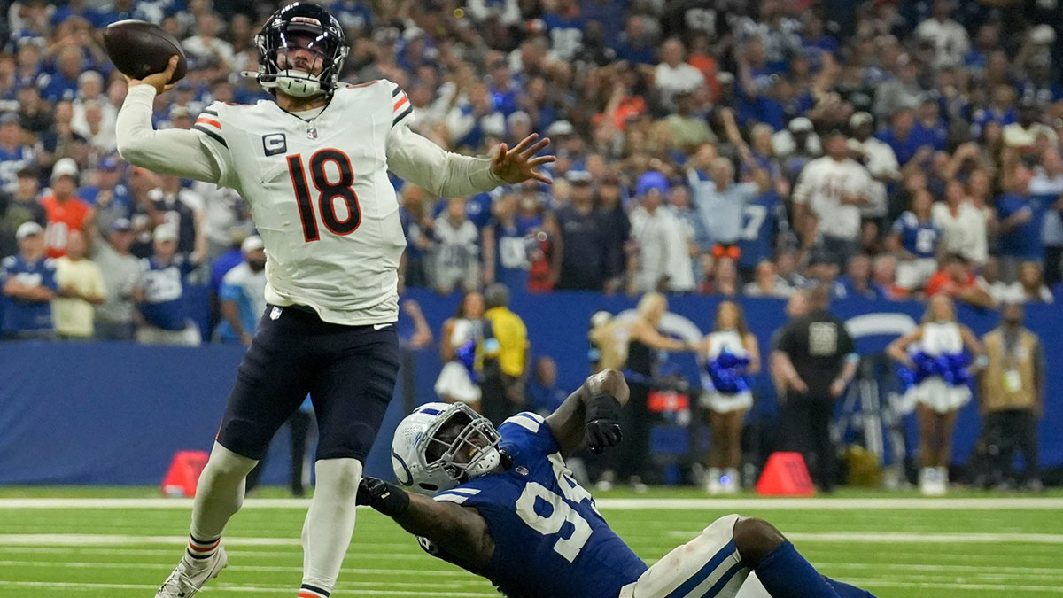Indianapolis Colts defensive end Tyquan Lewis (94) tries to tackle Chicago Bears quarterback Caleb Williams (18) on Sunday, Sept. 22, 2024, during a game against the Chicago Bears at Lucas Oil Stadium in Indianapolis.