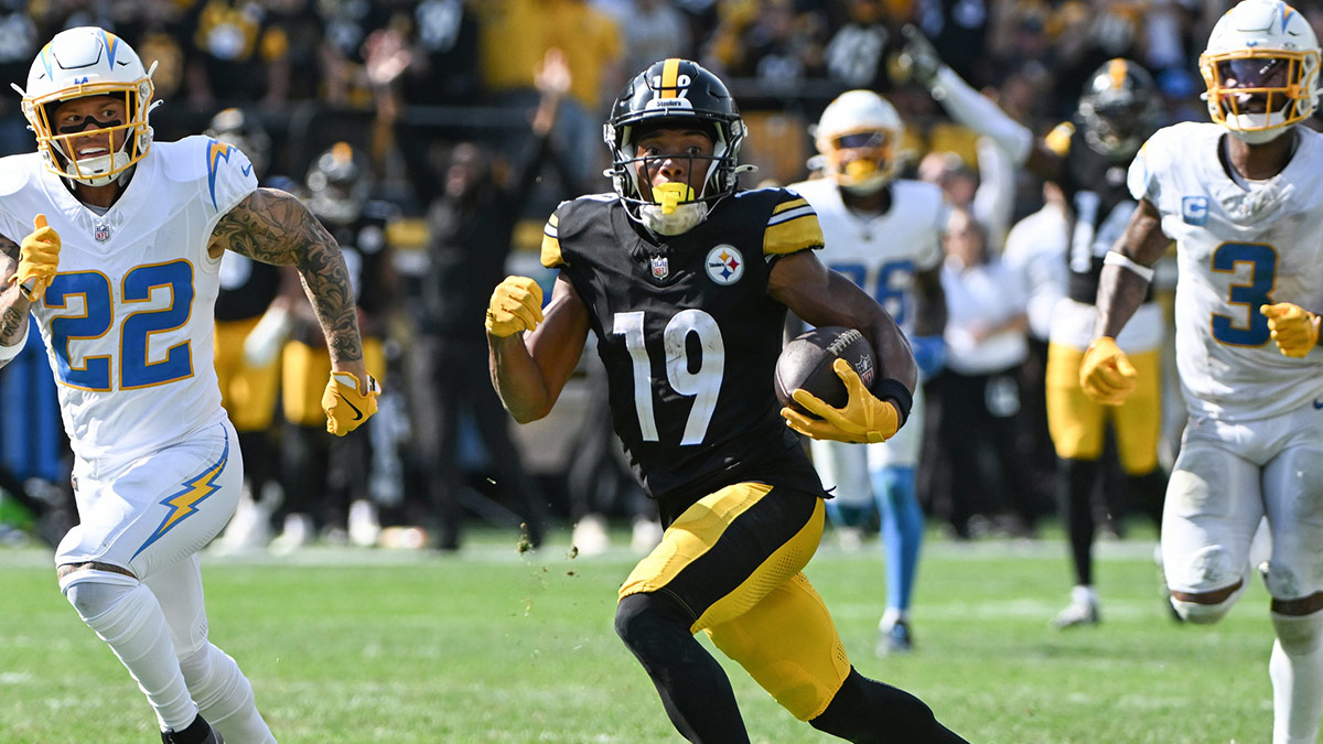 Pittsburgh Steelers wide receiver Calvin Austin III (19) scores a touchdown while being chased by Los Angeles Chargers cornerback Elijah Molden (22) during the fourth quarter at Acrisure Stadium.