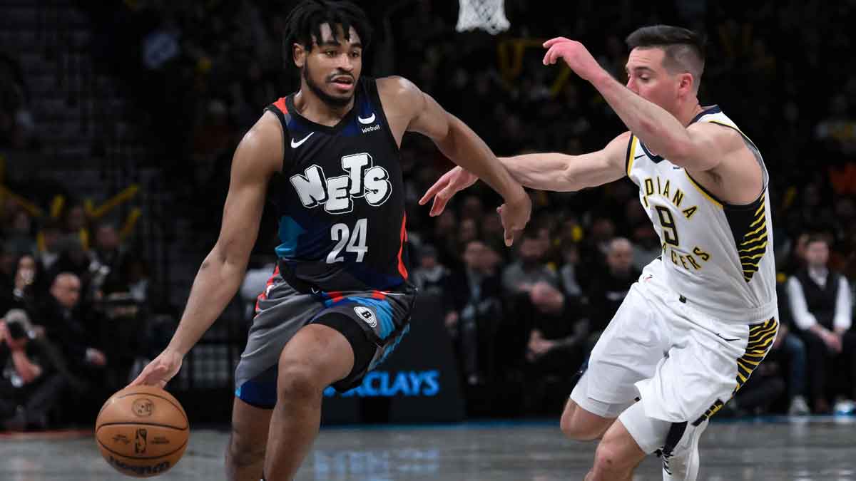 Brooklyn Nets guard Cam Thomas (24) drives to the basket while being defended by Indiana Pacers guard T.J. McConnell (9) during the third quarter at Barclays Center. Mandatory Credit: