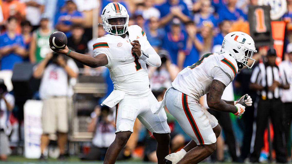 Miami Hurricanes quarterback Cam Ward (1) throws the ball against the Florida Gators during the second half at Ben Hill Griffin Stadium.