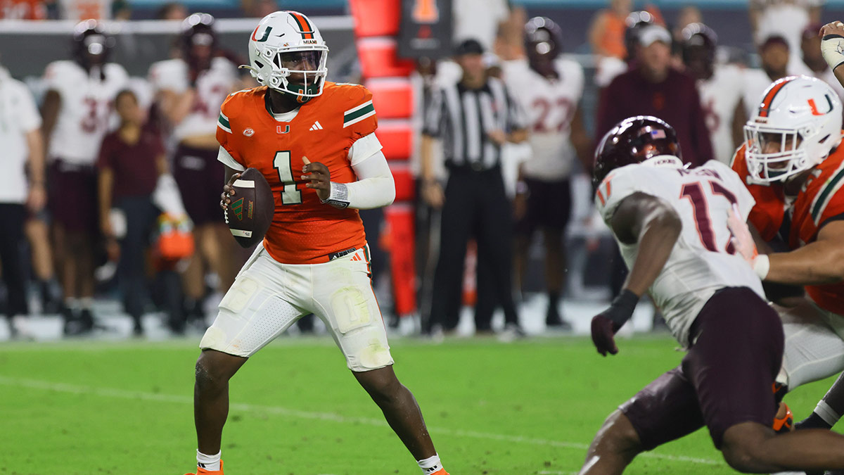 Miami Hurricanes quarterback Cam Ward (1) looks for a passing option against the Virginia Tech Hokies during the fourth quarter at Hard Rock Stadium.
