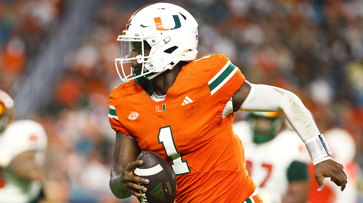 Miami Hurricanes quarterback Cam Ward (1) runs with the football for a touchdown against the Florida A&M Rattlers during the third quarter at Hard Rock Stadium.