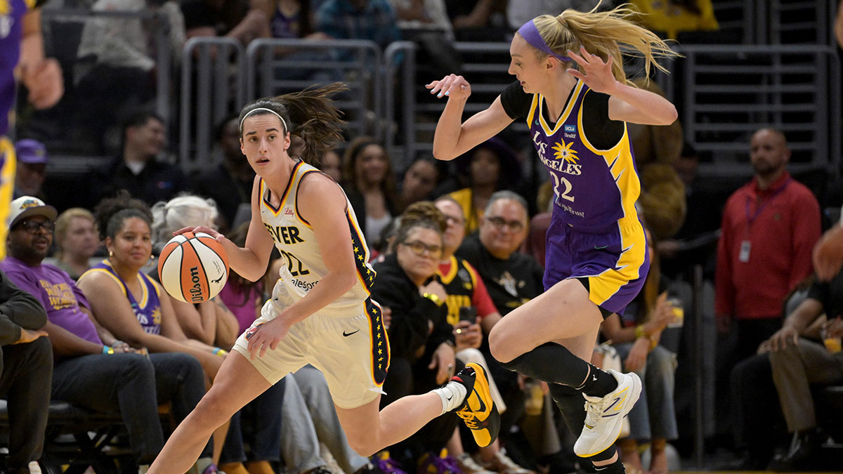 Indiana Fever guard Caitlin Clark (22) Los Angeles Sparks forward Cameron Brink (22) in the first half at Crypto.com Arena.