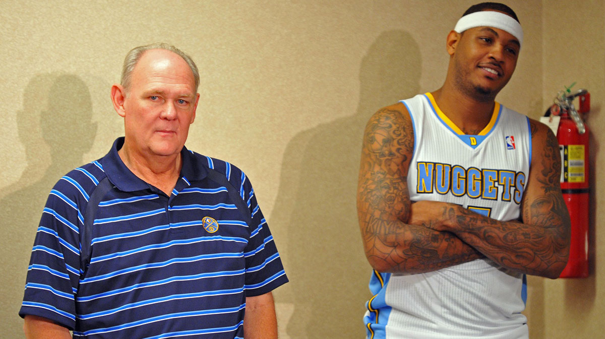 Denver Nuggets forward Carmelo Anthony (15) and head coach George Karl wait to speak during a press conference during media day at the Pepsi Center. 