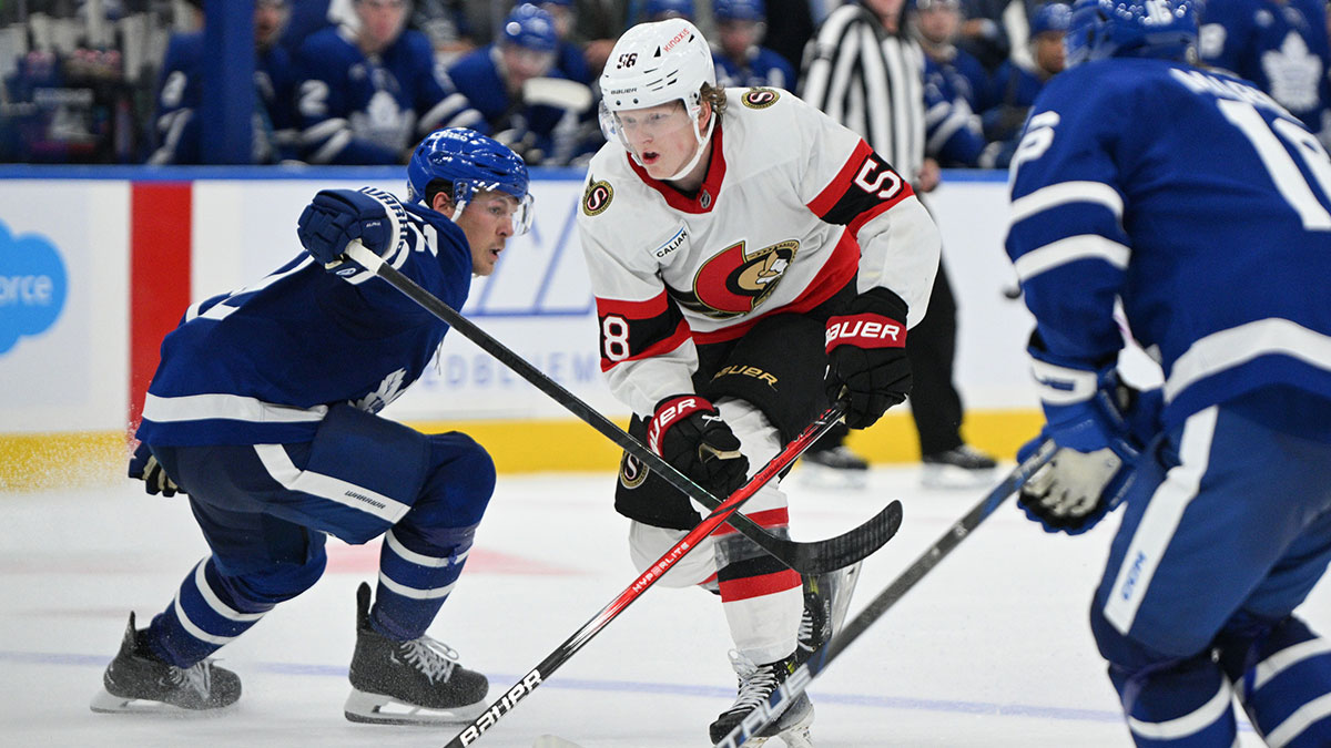 Ottawa Senators forward Carter Yakemchuk (58) skates past Toronto Maple Leafs defenseman Jake McCabe (22) as he moves in to score the winning goal in overtime at Scotiabank Arena.