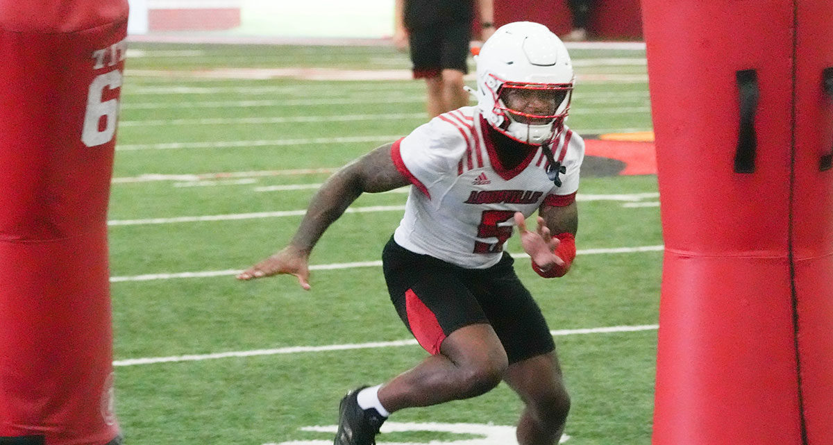 Louisville’s Caullin Lacy, a senior, ran some plays at the first practice of the year.