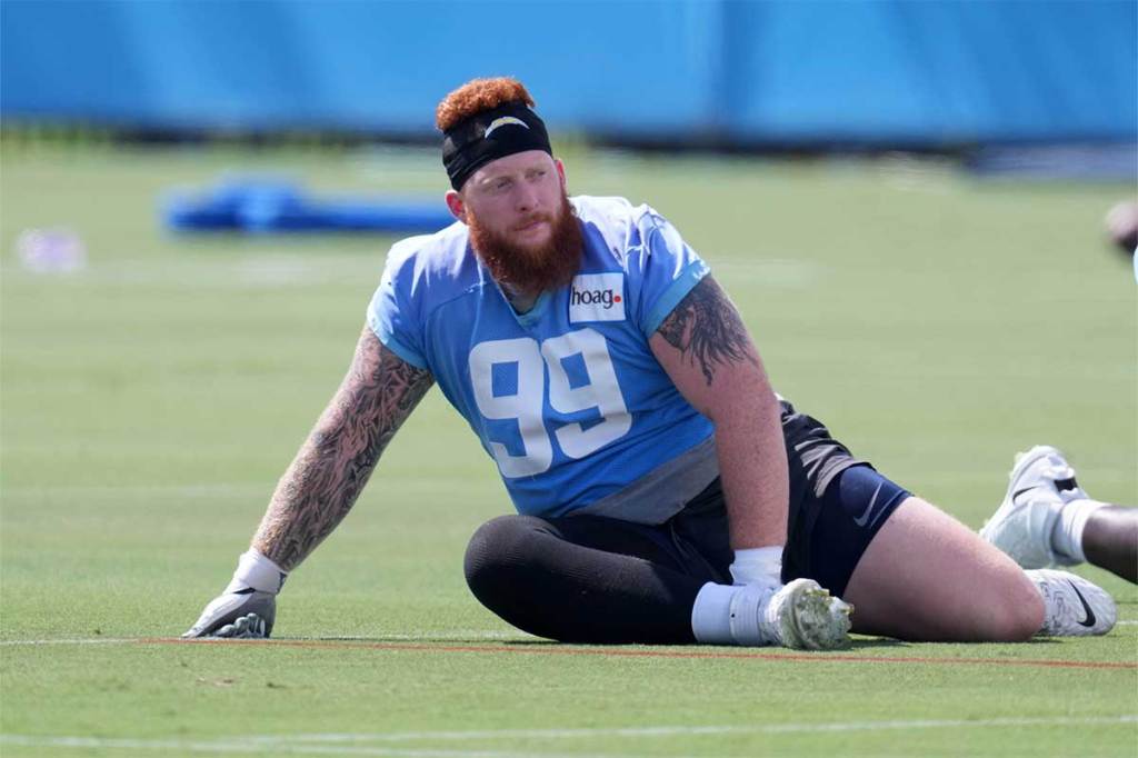 Los Angeles Chargers defensive lineman Scott Matlock (99) stretches during practice at the Hoag Performance Center.