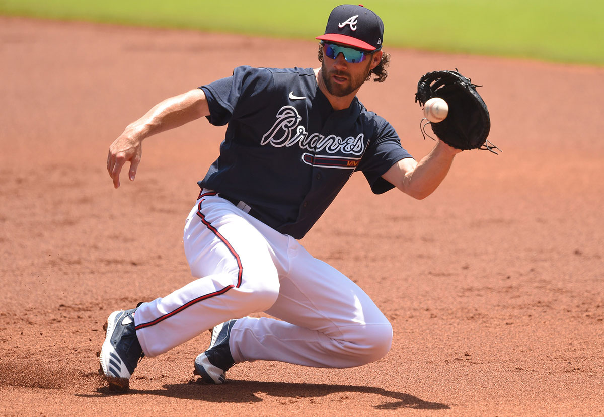 Atlanta Braves second baseman Charlie Culberson (8) fields a ground ball during an intrasquad game in their summer workout session at Truist Park.