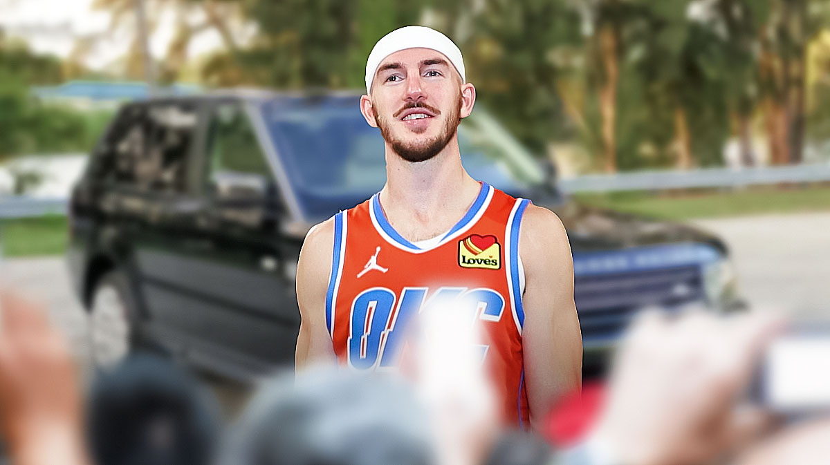 Alex Caruso in front of a car from his collection.